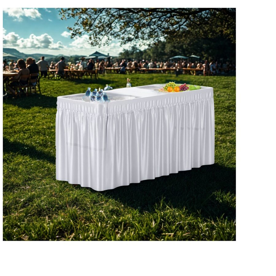 White folding cooler table with table skirt set up outdoors with drinks and fruit on ice